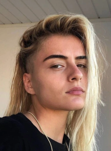 Edgy Undercut with Long, Flowing Hair and Side-Swept Bangs