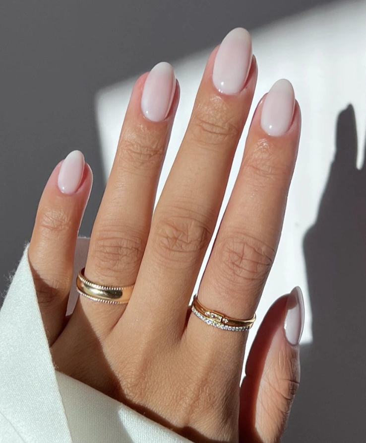 Elegant Oval Milky Nails with Subtle Sheen and Minimalist Charm