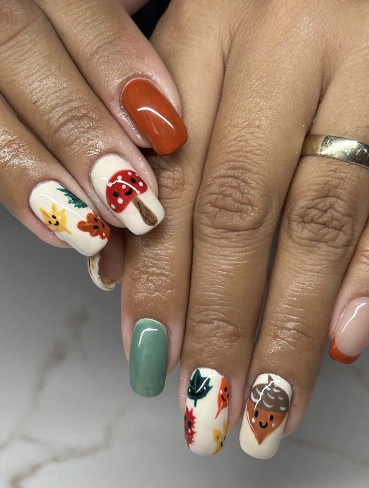 Fall Nails with Earthy Tones, Whimsical Acorn and Leaf Designs