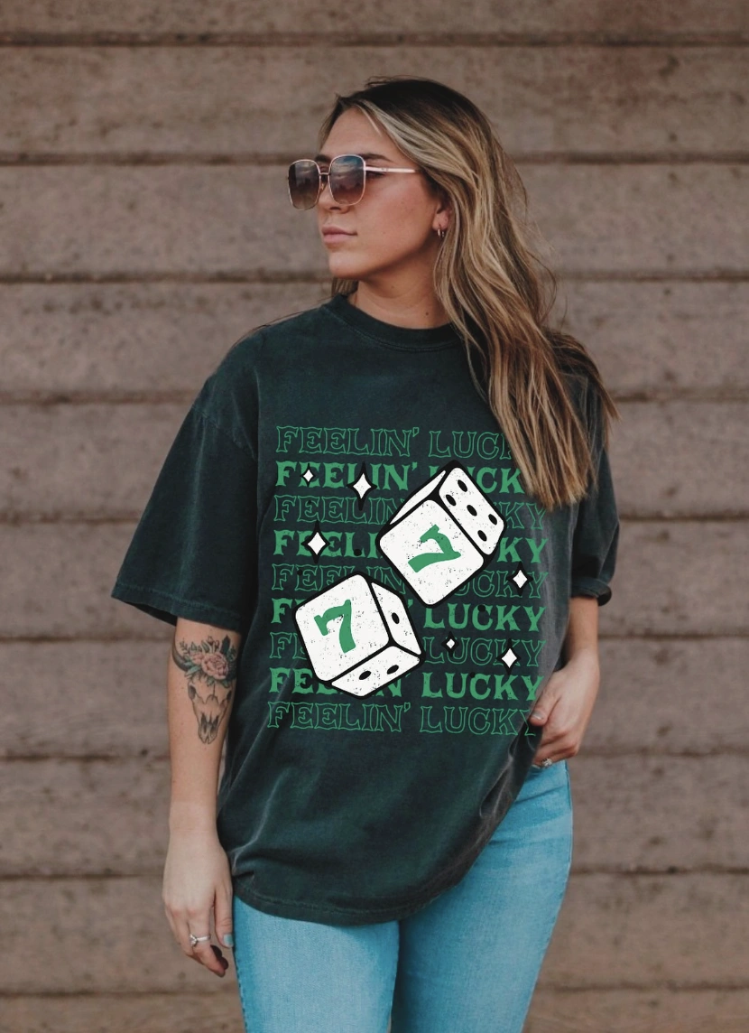 Feelin’ Lucky Graphic Tee + Light Wash Skinny Jeans + Casual White Sneakers