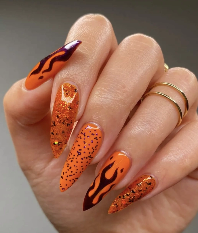 Fiery Orange Stiletto Nails with Glitter and Flame Details