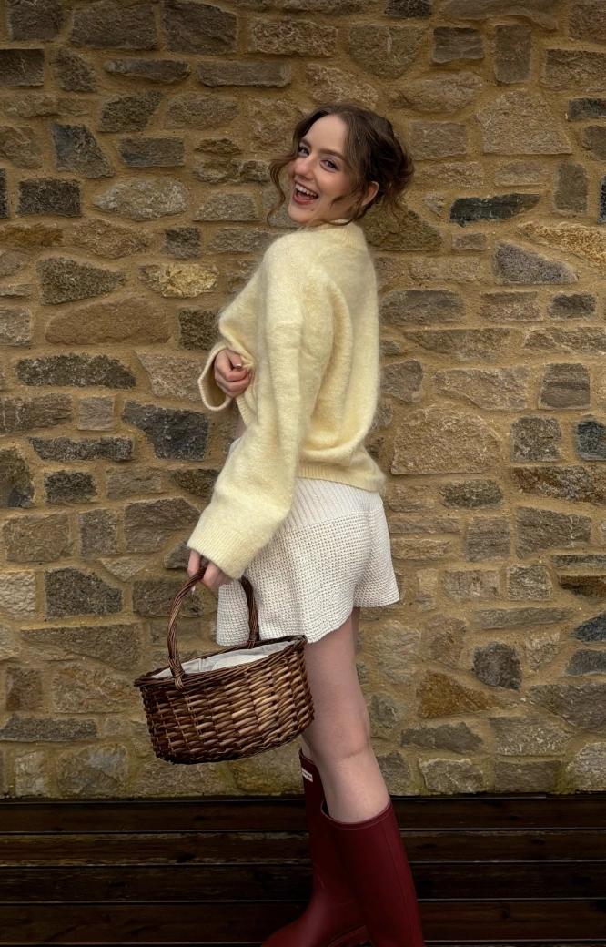 Fuzzy Yellow Sweater + Knit Shorts + Burgundy Rain Boots + Wicker Basket