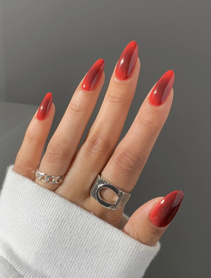 Glossy Red Ombre Almond Nails with Silver Rings