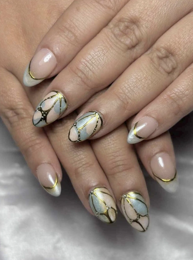 Golden Butterfly Wing Nail Art on Almond Shaped Tips