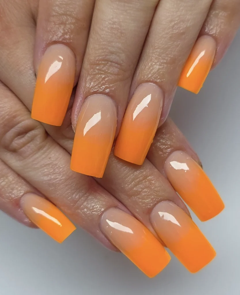 Gradient Nude to Bright Orange Square Nails