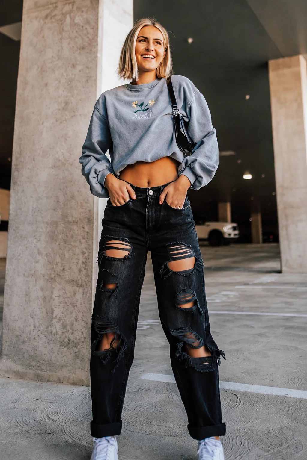Gray Cropped Sweatshirt + Black Ripped Straight-Leg Jeans + White Sneakers