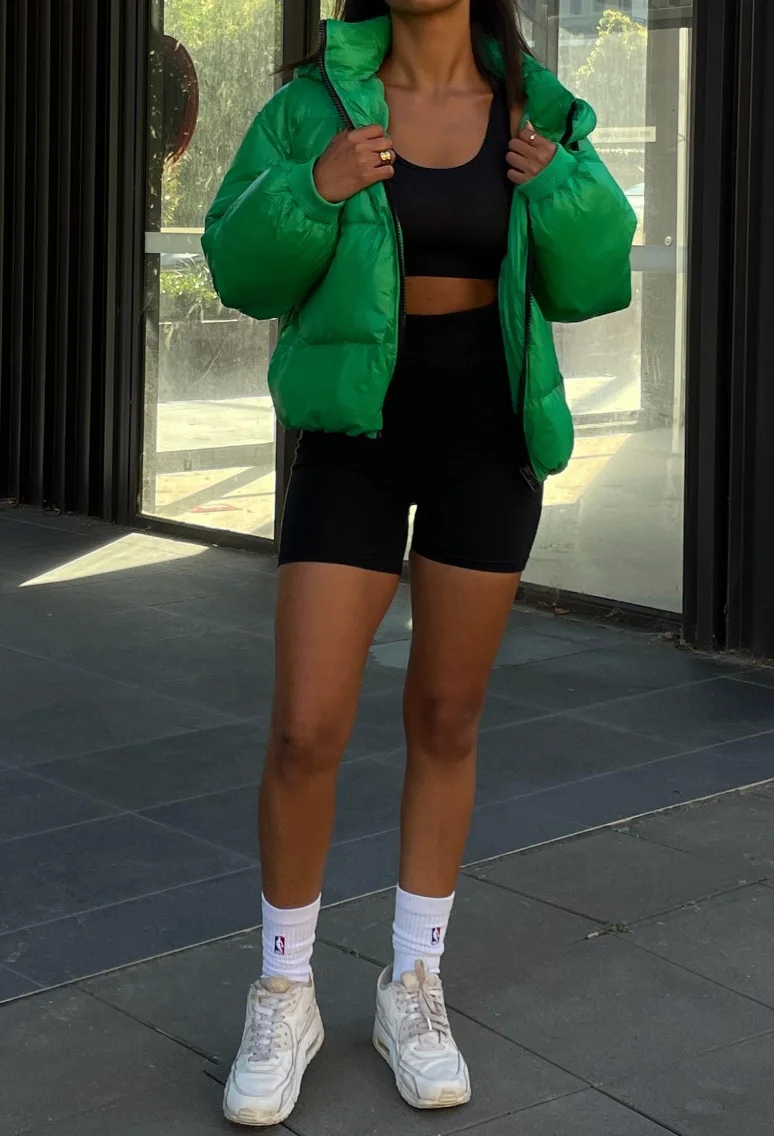 Green Puffer Jacket + Black Bike Shorts + Sports Bra