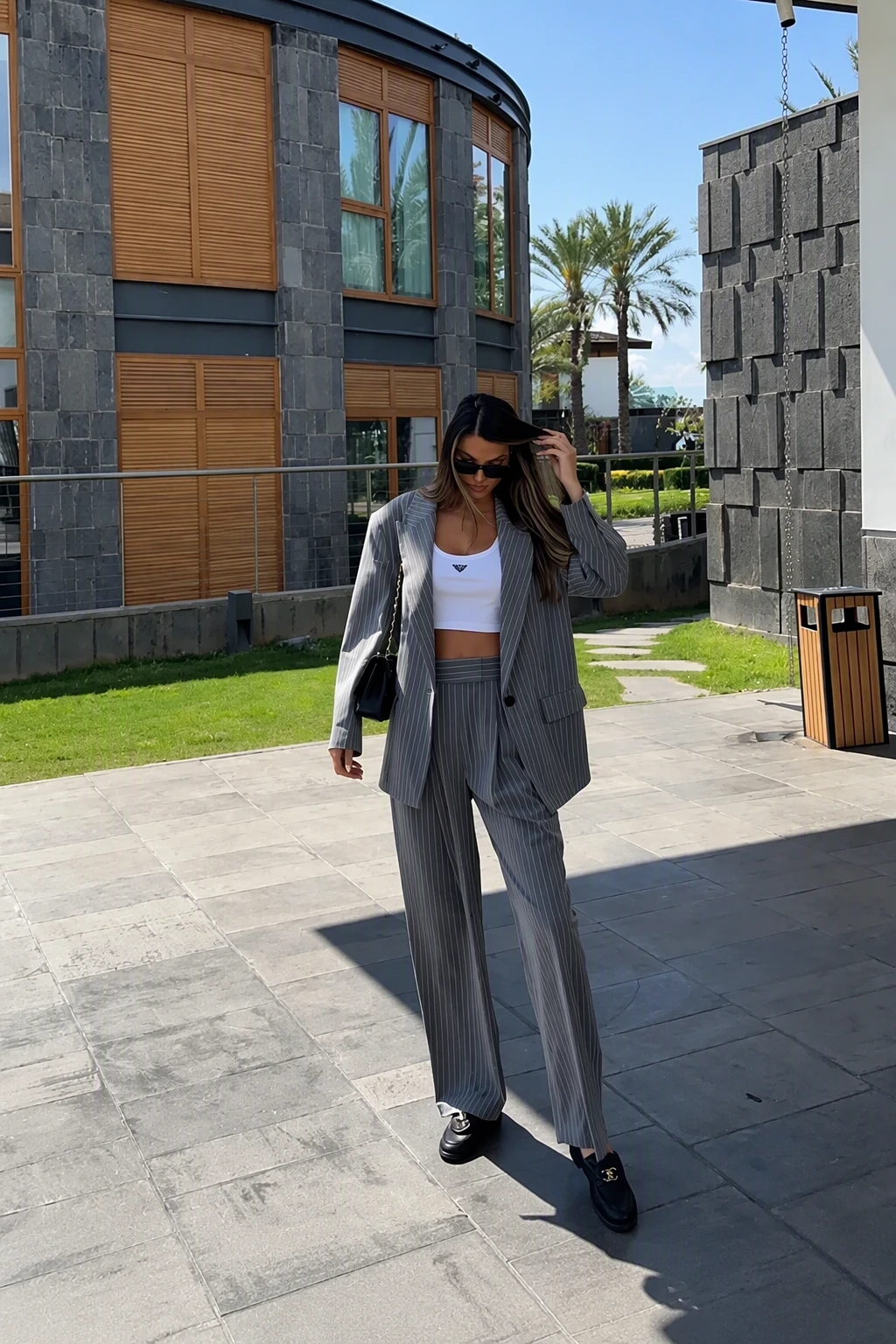 Grey Pinstripe Blazer + Grey Pinstripe Wide-Leg Trousers + White Crop Top + Black Loafers