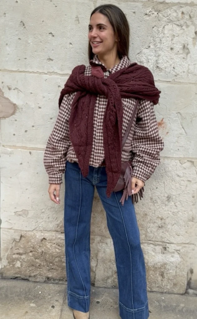 Houndstooth Button-Up Blouse + Burgundy Knit Sweater Tied Over Shoulders + Blue Flare Jeans