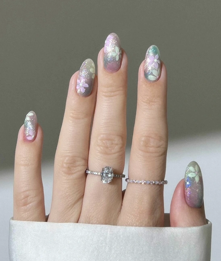 Iridescent Almond Nails with Soft Floral Accents