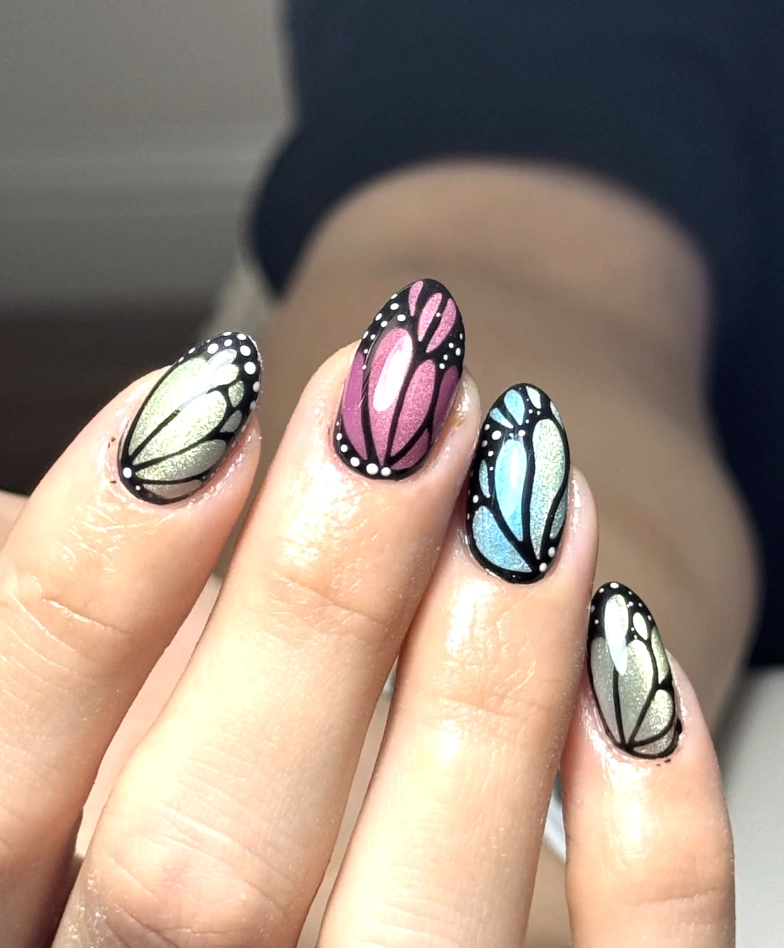 Iridescent Butterfly Wing Designs on Almond-Shaped Nails