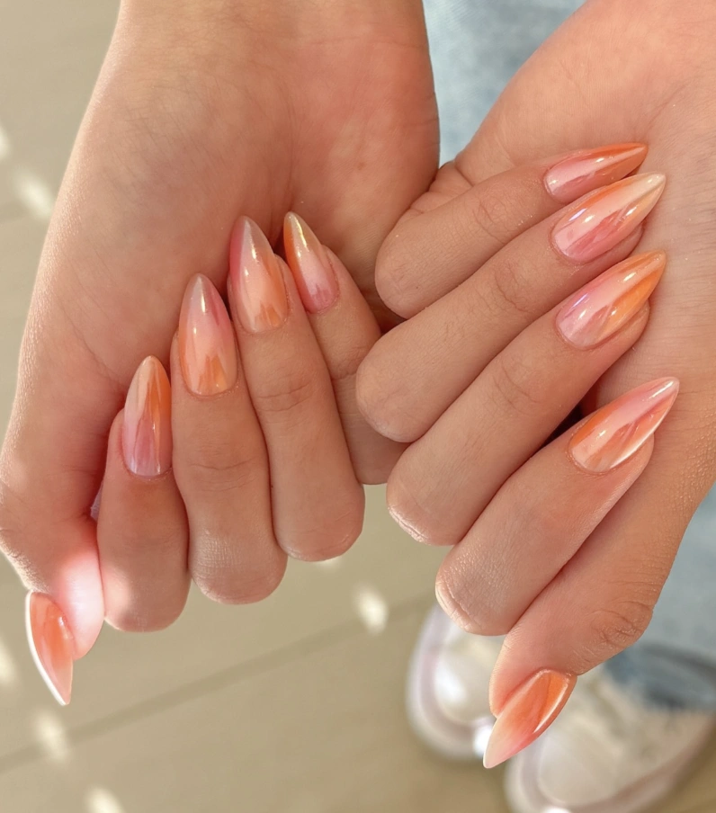 Iridescent Peach and Coral Stiletto Aura Nail Design