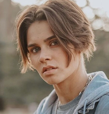 Layered Tomboy Cut with Textured Ends and Subtle Side Swept Bangs