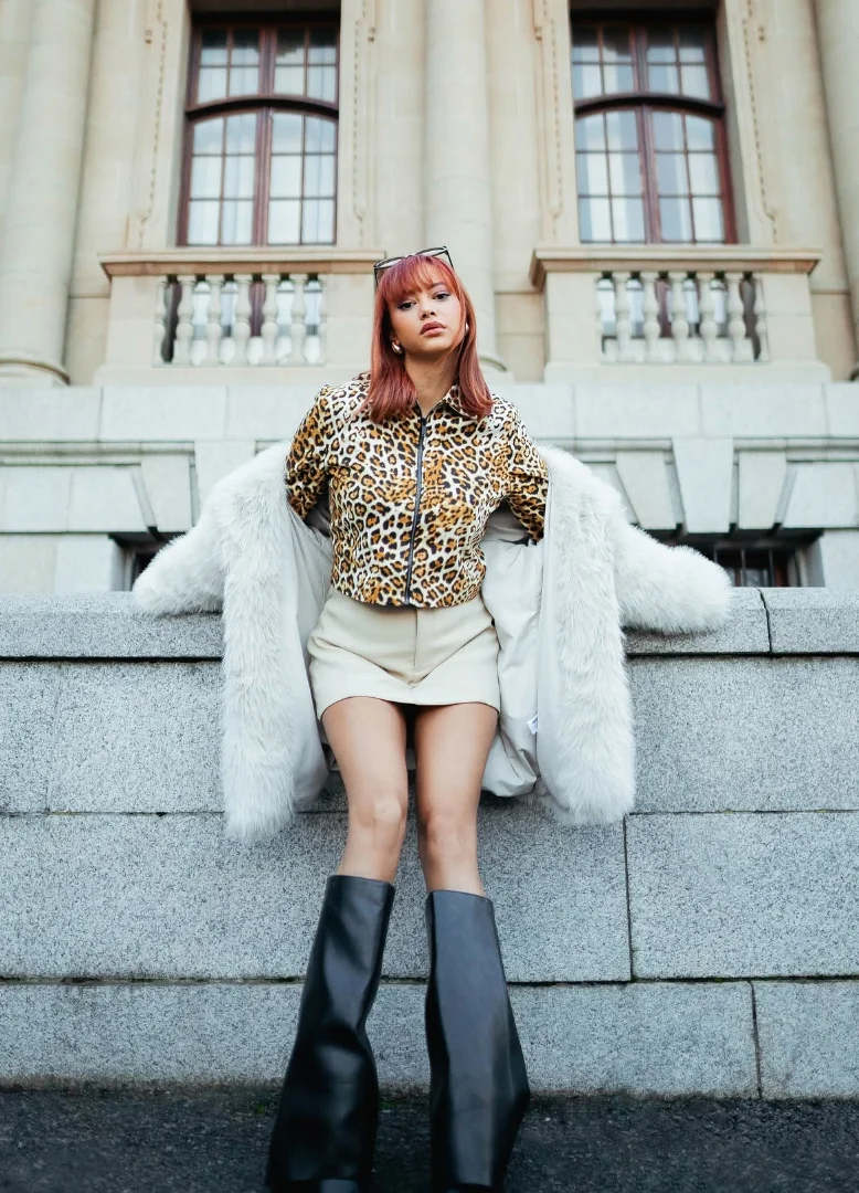 Leopard Print Zip-Up Shirt + White Mini Skirt + White Faux Fur Coat + Black Knee-High Boots
