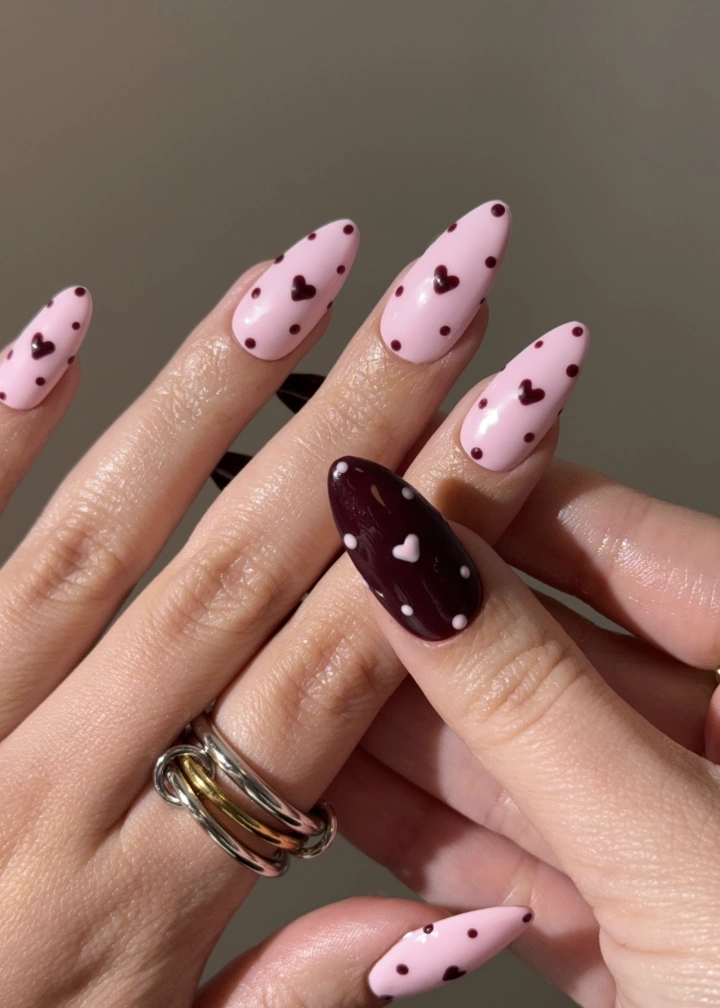 Light Pink Stiletto Nails With Burgundy Dots and Heart Accent