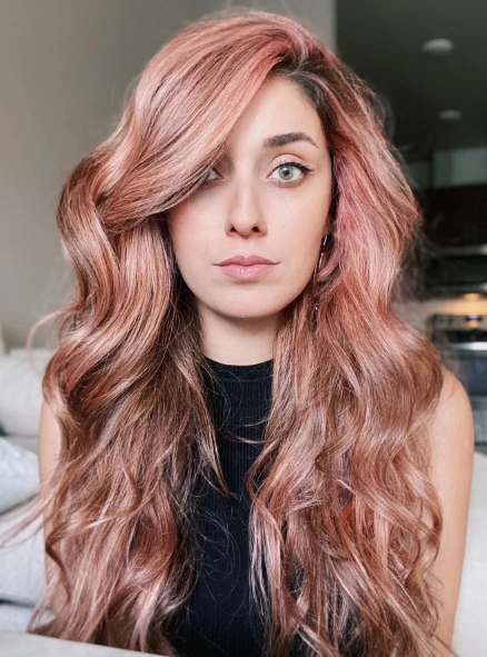 Long, Flowing Waves with Rose Gold Blonde Highlights and Side Bangs