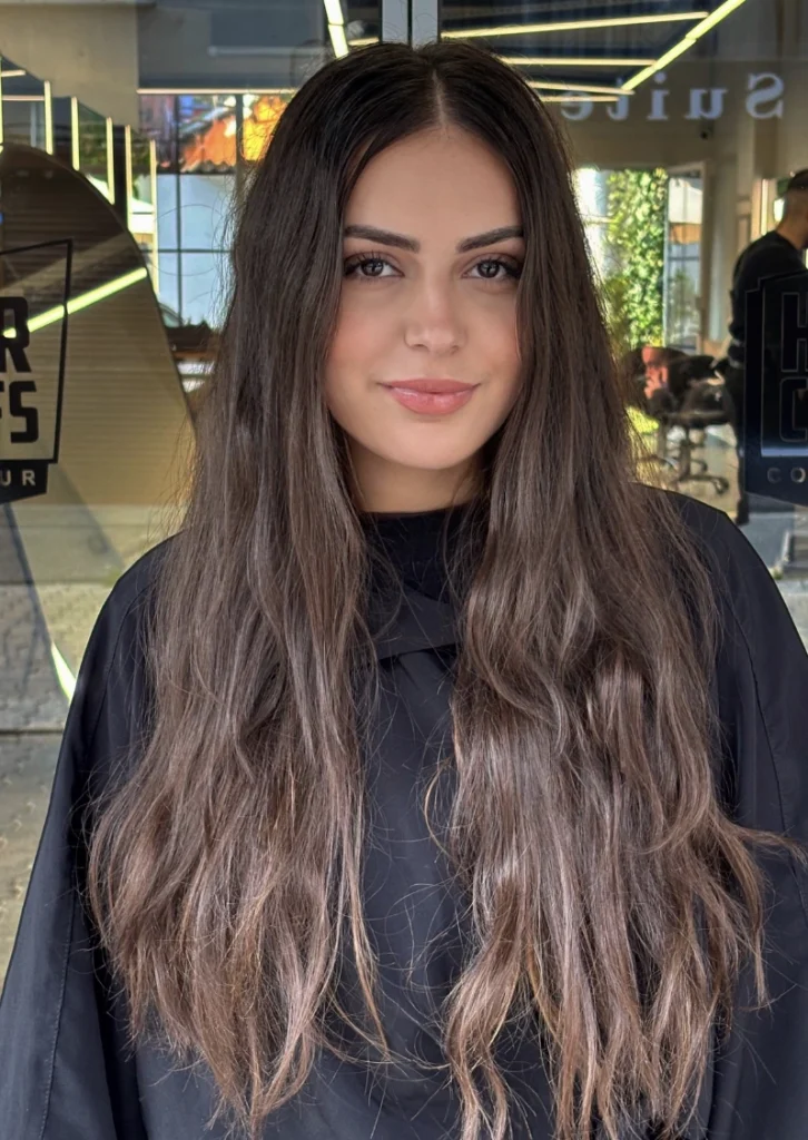 Long, Layered Brunette Waves with Subtle Highlights