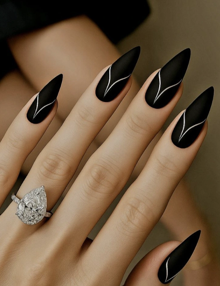 Matte Black Stiletto Nails with Silver Leaf Design