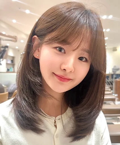 Medium-Length Layers with Bangs