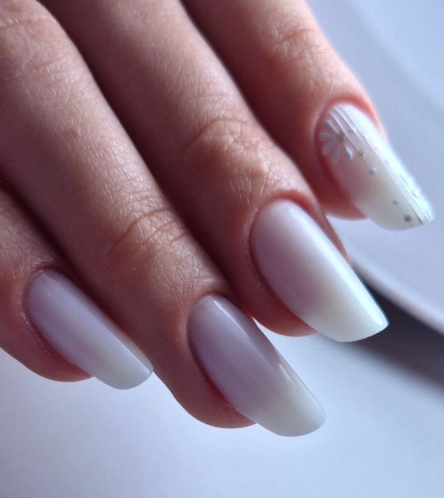 Milky Almond Nails with Delicate Floral Accents and a Glossy Finish