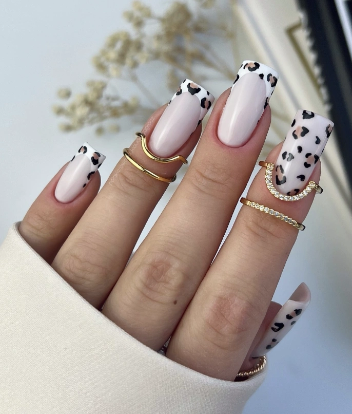 Milky Rose Nails with Bold Leopard Tips and Elegant Gold Accents