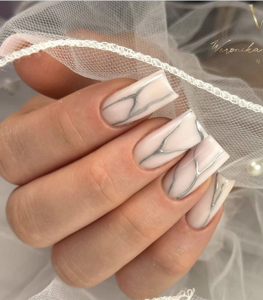 Milky White Nails with Silver Veins and Glossy Finish