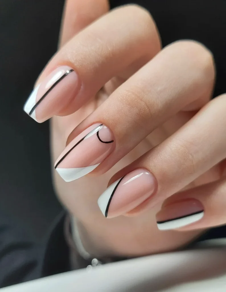 Modern Geometric Nail Art: Nude Base with Black & White Accents