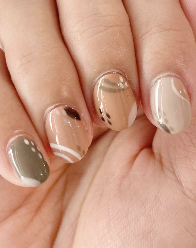 Muted Earth-Tone Nail Art with Geometric Accents