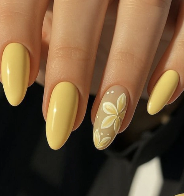 Muted Yellow Almond Nails with Floral Accent