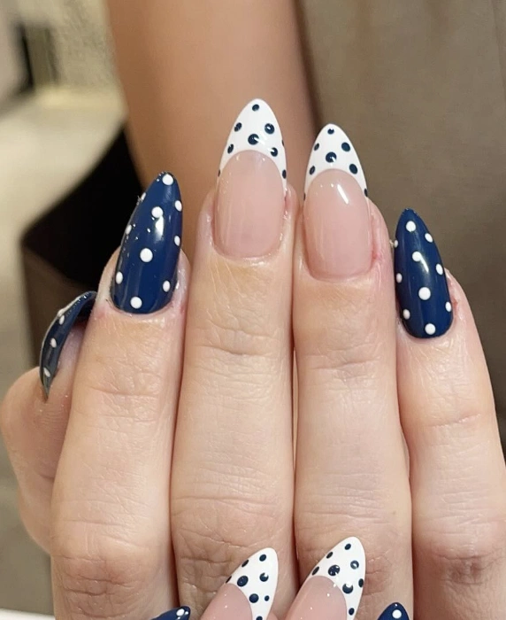 Navy and White Polka Dot Almond Nails with French Tip Accents