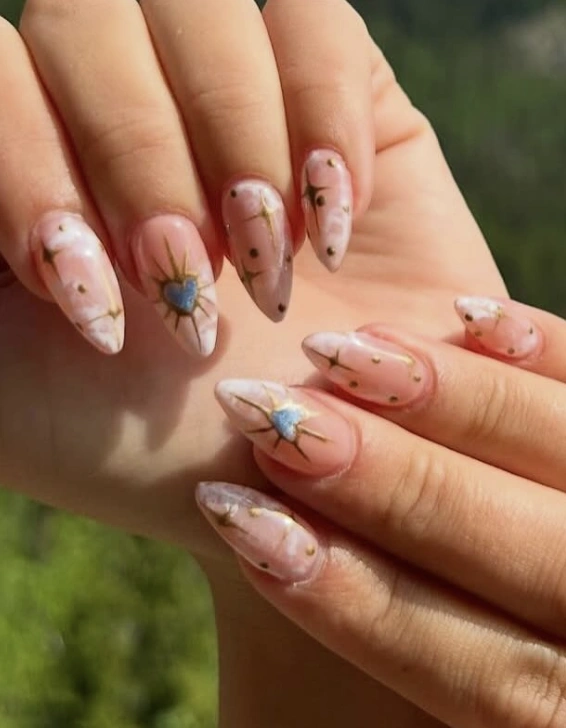 Nude Almond Nails with Celestial and Heart Designs