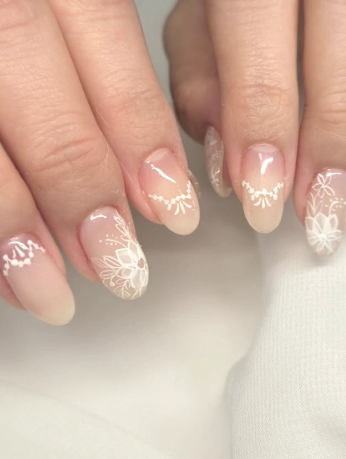 Nude Almond Nails with Delicate White Lace