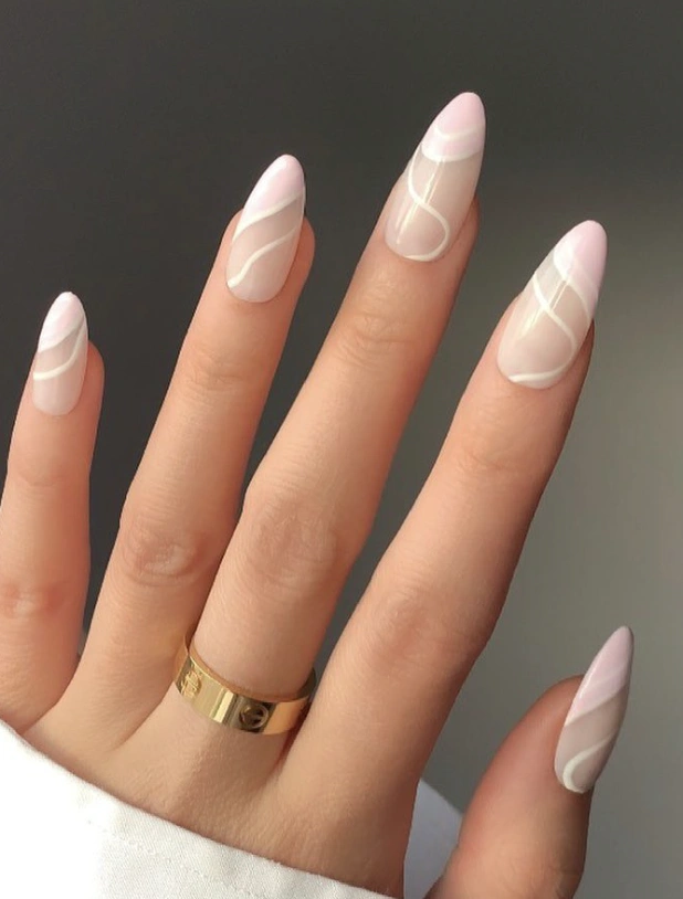 Nude Almond Nails with Pastel Pink Tips and White Swirls