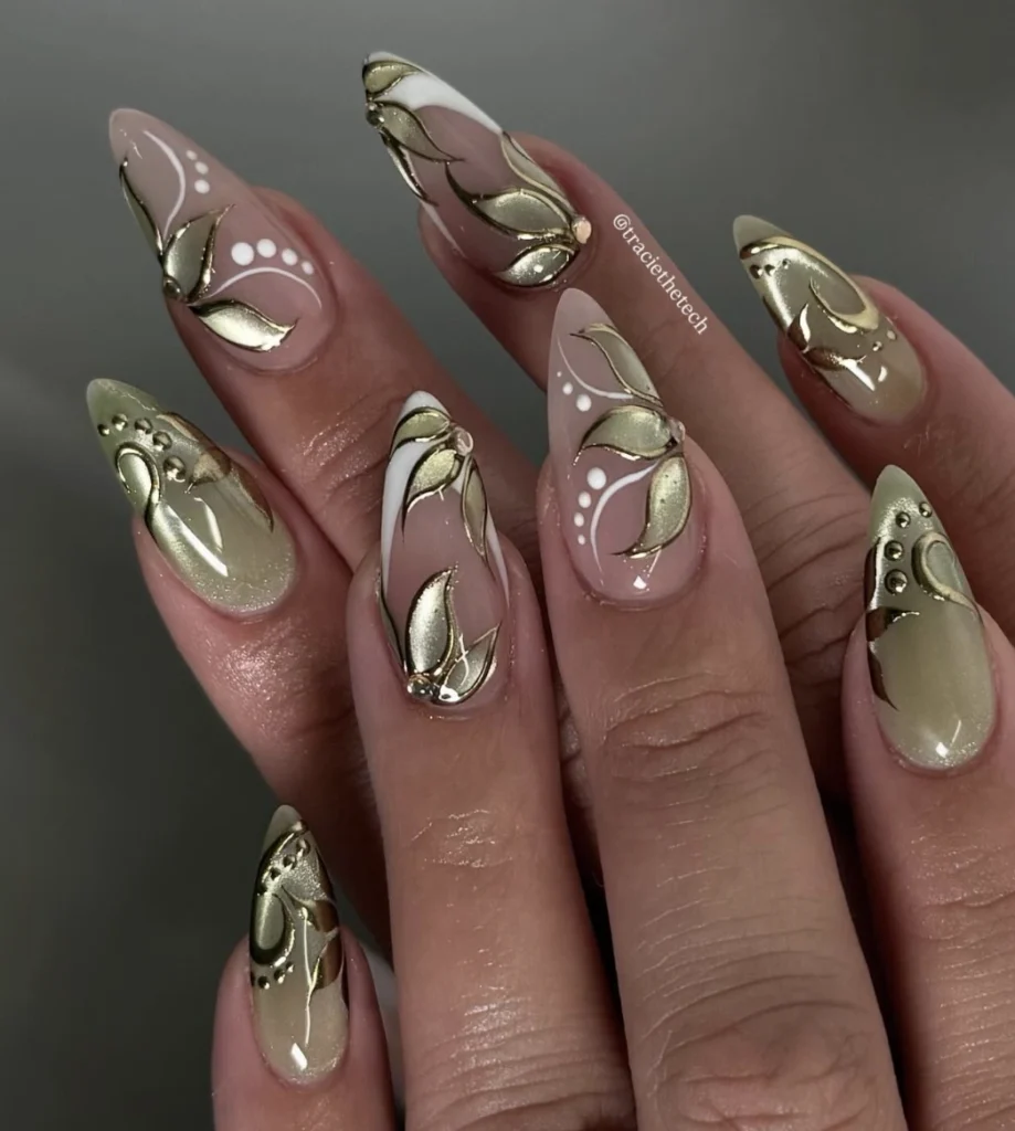 Nude Stiletto Nails with Golden Leaf Accents and White Details