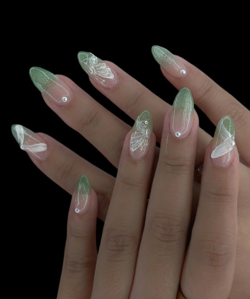Ombre Green Almond Nails with Butterfly Accents