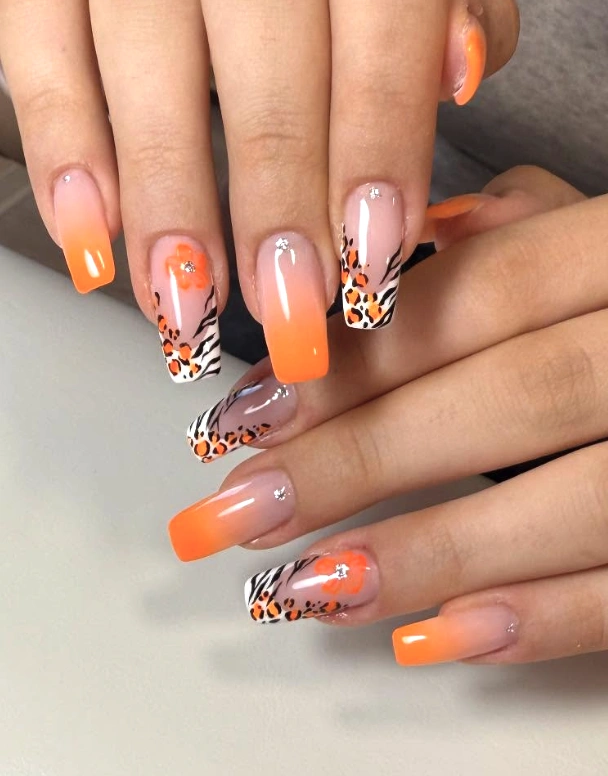 Ombre Orange Coffin Nails with Leopard-Zebra Print and Floral Accents