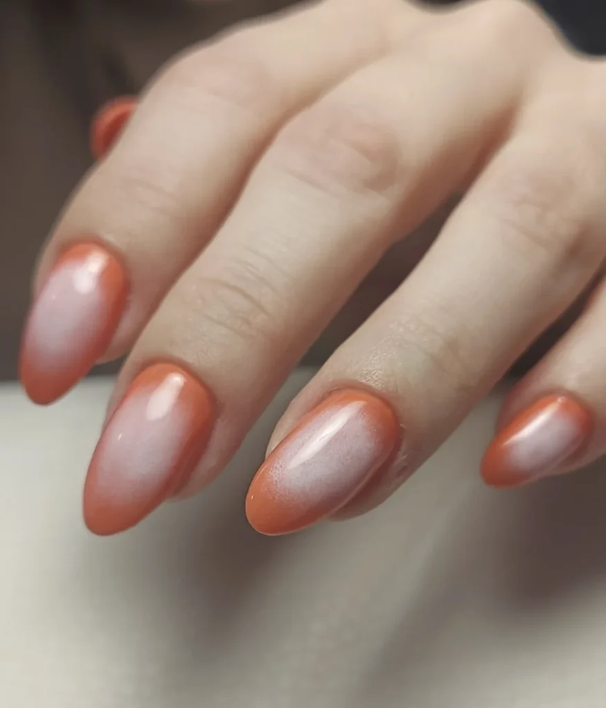 Orange Ombre Almond Nails with a Soft White Fade