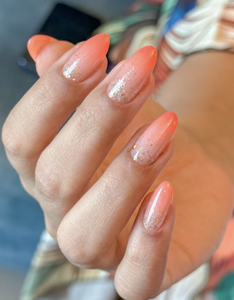 Orange Ombre Almond Nails with Glitter Fade