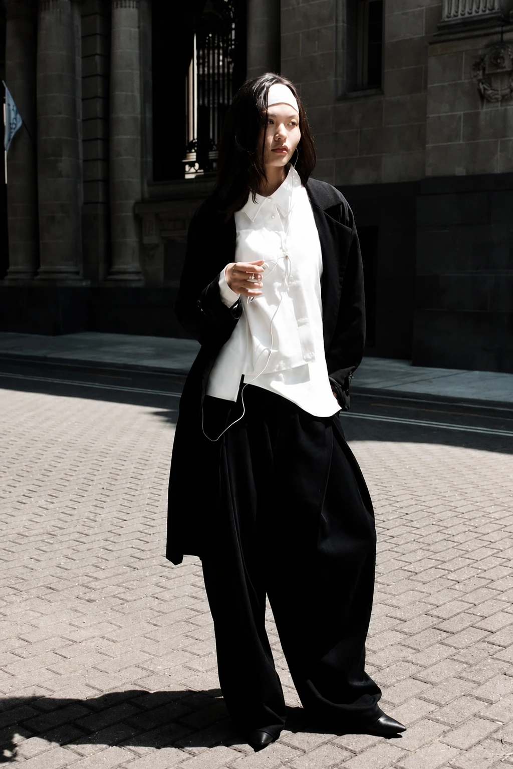 Oversized Black Coat + White Button-Down + Black Pleated Pants + Pointed Flats