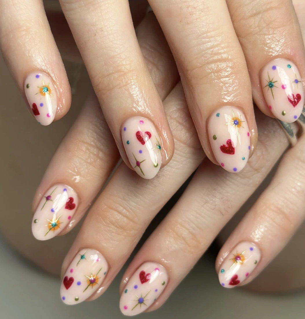 Pale Pink Almond Nails with Hearts and Polka Dots
