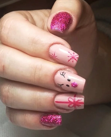 Pale Pink Coffin Nails with Reindeer, Snowflakes, and Hot Pink Glitter