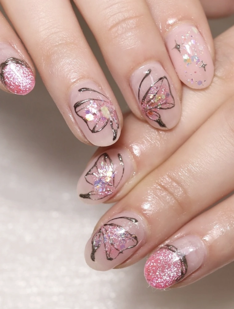 Pale Pink Oval Nails with Glitter Butterflies and Silver Outline