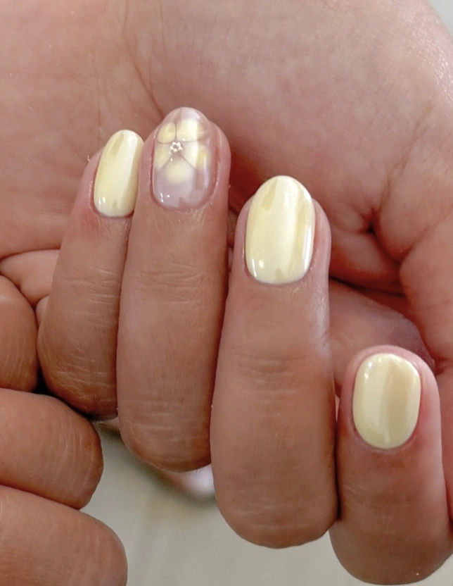Pale Yellow Manicure with Delicate Flower Accent