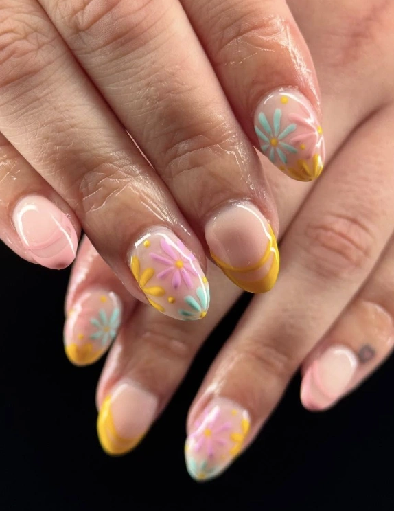 Pastel Daisy Nail Art with Yellow French Tips