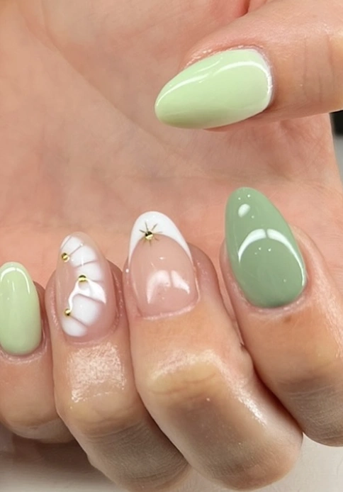 Pastel Green Almond Nails with 3D Floral and Gold Details