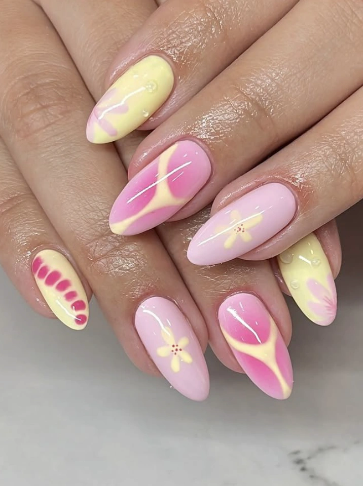 Pastel Ombre Almond Nails with Abstract Floral Accents