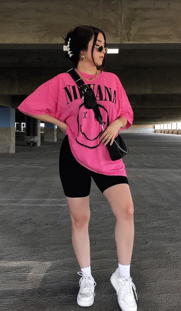 Pink Graphic Oversized T-Shirt + Black Biker Shorts + White Sneakers