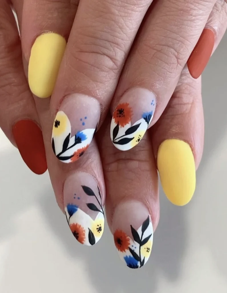 Playful Floral Nails in Soft Yellow, Burnt Orange, and Chic White Accents