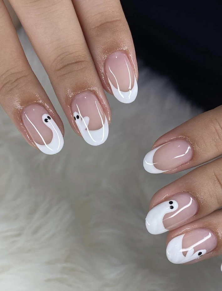 Playful Ghost French Tip Nails with Whimsical White and Clear Gloss Finish