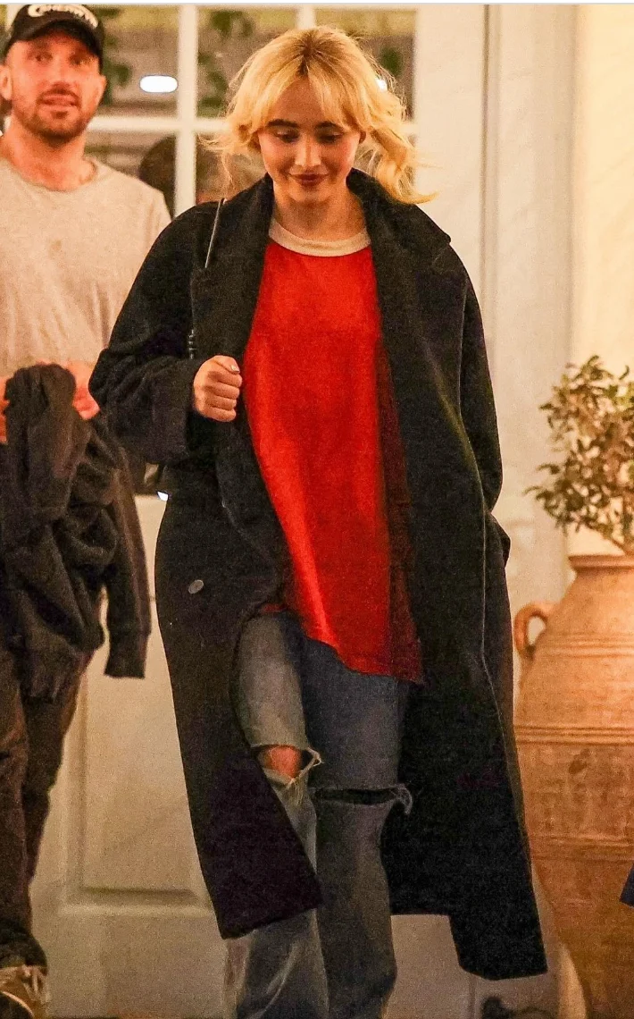 Red Crew Neck Top with Ripped Jeans and Black Coat